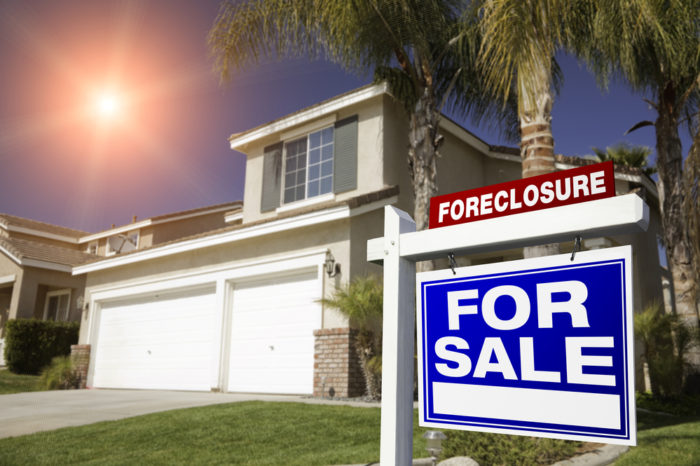 For sale sign on a foreclosed home in Florida